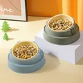 Lifestyle shot of two tilted raised pet bowls in blue and green colors filled with dry food - Regular Fit / Plastic Inner / Blue