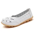 Comfortable white leather hollow-out loafers for women featuring a flexible tan sole - 35 / White