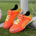 Bright orange youth turf soccer shoes with yellow gradient lines and velcro strap - 30 / Orange