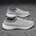 Ultra-light grey fly-knit slip-on walking shoes for women with a textured white sole - 35 / Gray
