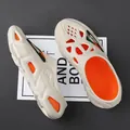 Sabots en mousse beige respirants pour hommes et femmes avec détails orange vifs - 38 / Rouge Orangé