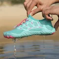 Mint green quick-dry water shoes for beach and surfing, showing water drainage feature. - Moon Blue