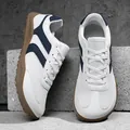 Retro German Army Trainer style sneakers in white and navy blue with a classic gum sole - 36 / White Blue