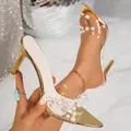 Elegant gold stiletto heels with transparent pearl straps and a pointed toe design. - 35 / Gold