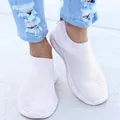 Comfortable white flyknit slip-on sneakers with breathable mesh and flat casual sole - 35 / White