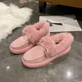 Cozy pink fuzzy winter loafers for women featuring a decorative bow and thick flat sole - 36 / Pink
