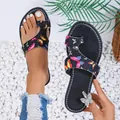 Close-up detail of colorful butterfly print on ethnic style women's toe loop sandals - 36 / Black Blue Pink Butterfly