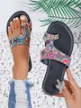 Detailed view of vibrant ethnic style painted toe-loop sandals against white pebbles - 36 / Rhinestone Butterfly Decorated Style / Geometric Circles