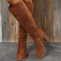 Close-up of brown suede knee-high boots with block heel and side zipper detail - 36 / Brown