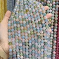 Vue détaillée des perles rondes en morganite naturelle 5A aux tons pastels pour bijoux DIY. - Qualité 5A Morganite