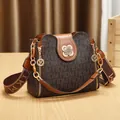 Fashionable brown printed bucket bag with decorative chain and wide logo shoulder strap - Style F / Brown