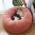 Soft pink plush round donut cat bed with fluffy faux fur for winter warmth and comfort - M / Flesh Pink