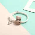 Adorable white pet collar featuring a knitted brown rabbit charm and silver bell - Pink Rabbit