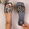 Macro detail view of stylish leopard print flat slide sandals with comfortable sole - 36 / Leopard Print