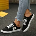 Zwarte canvas slip-on mule sneakers voor dames met witte veters voor de zomer - 35 / Zwart