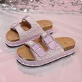 Close-up of purple platform sandals with pearl and rhinestone double strap design. - Violet