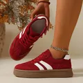 Macro detail view showing red suede platform sneakers with white stripes and gum sole - 36 / Red
