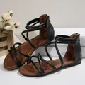 Women's flat Roman sandals with black cross straps and convenient back zipper closure - 36 / Black