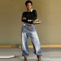 Women's deconstructed layered jeans with asymmetrical waist in washed blue denim - S / Bottoms / Light Blue