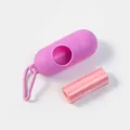 Portable purple capsule pet waste bag dispenser including one roll of pink plastic bags - Capsule Box + Waste Bag / Magenta