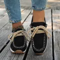 Detailed view of women's black suede moccasin loafers featuring thick rope laces - 36 / Black