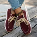Detail of ethnic style burgundy suede loafers with thick rope laces on wooden deck - 36 / Burgundy