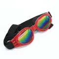 Red foldable dog goggles with rainbow reflective lenses and adjustable black strap - Red