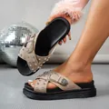 Close-up of beige cross-strap platform sandals with silver studs and ornate buckles - 35 / Apricot