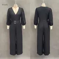 Front and back view of an elegant black deep V-neck jumpsuit with puff sleeves and belt - S / Black