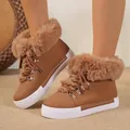 Stylish brown leather snow boots with fluffy faux fur trim and warm plush lining inside. - Tan