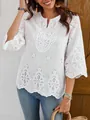 Close-up of white lace V-neck blouse featuring intricate floral embroidery details - S / Tops / White