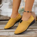 Close-up of women's yellow suede wedge loafers with pointed toe and slip-on design - 36 / Yellow
