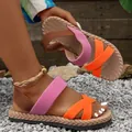Close-up of colorful criss-cross elastic strap sandals with lightweight flat soles. - 36 / Orange