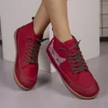 Side view of red high-top flat sneakers featuring a cute cartoon cat print design - 36 / Red