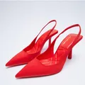 Close-up of red pointed-toe slingback heels with elegant quilted footbed detail - 35 / Red