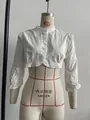 Detail view of the white vintage lace-trimmed cropped shirt with puff sleeves - S / Tops / White