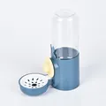 Blue cage-mounted pet water dispenser for rabbits and hamsters with clear storage bottle - Rabbit Style Waterer Deep Blue