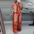 Mirror selfie of a bohemian floral print 2-piece set with top and wide-leg pants - XS / Top And Bottom / Red