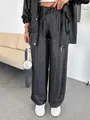 High-quality detail of black glossy straight-leg pants with elastic drawstring waist design - S / Bottoms / Black