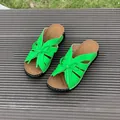Detailed view of bright green peep-toe wedge slippers with hollow design and cute bow decoration - Green
