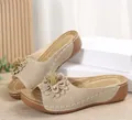 Elegant beige wedge sandals with open-toe design and a decorative floral accent - Off White