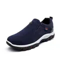 Detailed view of navy blue suede-textured men's outdoor casual slip-on shoe with sole - 38 / Blue