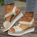 Close-up detail of women's wedge sandals featuring double metal rings and espadrille rope soles - 38 / Off White