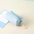 Mini light blue pet waste bag dispenser with golden metal clasp for walking dogs - Aqua Blue