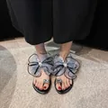 Elegant black flat sandals featuring large mesh bows and crystal-embellished toe-loop - 35 / Gray