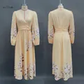 Detailed front and back view of a yellow floral long sleeve V-neck pleated maxi dress for women - S / Dresses / Yellow