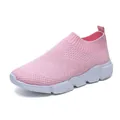 Breathable pink flyknit slip-on sneakers for women featuring a lightweight white sole. - 36 / Pink