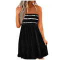 Detail view of black strapless dress with white smocked ruffled bust and stripes. - Black Background White Stripes