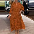 Detailed view of bohemian print loose maxi dress with long sleeves in vibrant orange - S / Dresses / Orange