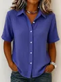 Close-up of a women's blue textured cotton short-sleeve button-up shirt in casual style - 3XL / Tops / Sapphire Blue